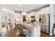 White kitchen with granite island, stainless steel appliances, and plenty of natural light at 2301 Ardeer Dr, Charleston, SC 29414