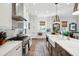 Spacious kitchen boasting white cabinets, farmhouse sink, and a large island at 2531 Helmsman Rd, Johns Island, SC 29455