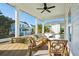 Relax on this screened porch with seating, a ceiling fan, and views of the neighborhood at 2531 Helmsman Rd, Johns Island, SC 29455