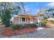 Brick home with covered porch, decorative railing, and front yard at 312 George St, Walterboro, SC 29488