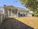 Backyard view of house, screened porch, and hot tub at 3340 Middlesboro Ave, Summerville, SC 29485