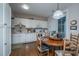 Eat in kitchen with white cabinets, wood table and french doors at 3496 Henrietta Hartford Rd, Mount Pleasant, SC 29466