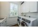 Laundry room with washer, dryer, and white cabinets at 3496 Henrietta Hartford Rd, Mount Pleasant, SC 29466