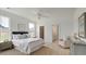 Spacious bedroom with carpeted floor, en suite bathroom, and ample natural light at 368 Trailmore Ln, Summerville, SC 29486