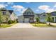 Two-story craftsman home with gray siding and a pink door at 368 Trailmore Ln, Summerville, SC 29486
