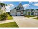 Gray house with white garage doors and pink front door at 368 Trailmore Ln, Summerville, SC 29486