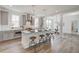 Modern kitchen boasts a large island, stainless steel appliances, and white shaker cabinets at 368 Trailmore Ln, Summerville, SC 29486