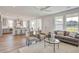 Open living room and kitchen with grey accents and white walls at 368 Trailmore Ln, Summerville, SC 29486