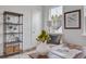 Home office with built-in shelving, comfortable seating, and large window at 368 Trailmore Ln, Summerville, SC 29486