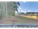 View of grassy backyard and neighborhood at 373 Whispering Breeze Ln, Summerville, SC 29486