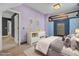 Charming bedroom with lavender walls and a unique wall feature at 373 Whispering Breeze Ln, Summerville, SC 29486