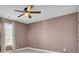 Bedroom with mauve walls and ceiling fan at 373 Whispering Breeze Ln, Summerville, SC 29486
