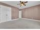 Bedroom with mauve walls, double door closet and ceiling fan at 373 Whispering Breeze Ln, Summerville, SC 29486