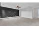 Large bonus room with dark accent wall and ceiling fan at 373 Whispering Breeze Ln, Summerville, SC 29486