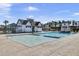 Resort-style pool with cabana and lounge chairs at 373 Whispering Breeze Ln, Summerville, SC 29486