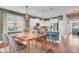 Bright dining area with wood table and chairs, adjacent to kitchen at 373 Whispering Breeze Ln, Summerville, SC 29486