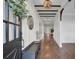 Bright entryway with hardwood floors, shiplap walls, and a built-in bench at 373 Whispering Breeze Ln, Summerville, SC 29486