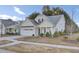 Craftsman style home with white siding, gray roof and landscaping at 373 Whispering Breeze Ln, Summerville, SC 29486