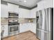White kitchen cabinets, stainless steel appliances, and granite counters at 373 Whispering Breeze Ln, Summerville, SC 29486