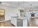 Large kitchen island with granite countertop and stainless steel dishwasher at 373 Whispering Breeze Ln, Summerville, SC 29486