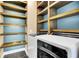 Laundry room with washer, dryer, and built-in shelving at 373 Whispering Breeze Ln, Summerville, SC 29486