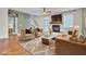 Living room with fireplace, hardwood floors, and stylish furniture at 373 Whispering Breeze Ln, Summerville, SC 29486