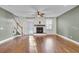 Hardwood floor living room with fireplace and access to backyard at 373 Whispering Breeze Ln, Summerville, SC 29486