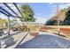 Pergola with seating and fire pit overlooking pond at 373 Whispering Breeze Ln, Summerville, SC 29486