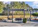 Pergola with swings and fire pit, near a pond at 373 Whispering Breeze Ln, Summerville, SC 29486