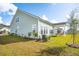 Green house exterior with landscaped yard at 428 Parish Farms Dr, Summerville, SC 29486