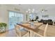 Bright dining area with wooden table and chairs, adjacent to living room at 432 Eva St, Moncks Corner, SC 29461