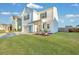 Two-story white house with a green door, landscaping, and a two-car garage at 432 Eva St, Moncks Corner, SC 29461