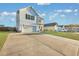 Two-story white house with a green door, landscaping, and a two-car garage at 432 Eva St, Moncks Corner, SC 29461