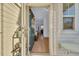 Open front door revealing a glimpse of the interior's hardwood floors and living area at 432 Eva St, Moncks Corner, SC 29461