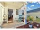Inviting front porch with rocking chair and potted plants, showcasing a welcoming entrance at 432 Eva St, Moncks Corner, SC 29461