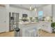 Modern kitchen featuring white cabinets, stainless steel appliances, and an island at 432 Eva St, Moncks Corner, SC 29461
