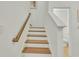 Modern staircase with wood treads and white risers at 432 Eva St, Moncks Corner, SC 29461