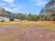 Spacious backyard with shed and wooded area at 5330 Halfway Creek Rd, Huger, SC 29450