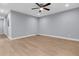 Empty bedroom with light gray walls and wood floors at 5330 Halfway Creek Rd, Huger, SC 29450