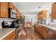 Bright kitchen with stainless steel appliances and ample wood cabinetry at 640 Old Back River Rd, Goose Creek, SC 29445