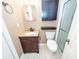 Clean bathroom with dark vanity, shower, and linen cabinet at 7911 Timbercreek Ln # A, North Charleston, SC 29418