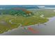 Aerial view showcasing the home's private dock, HOA boat ramp, and HOA dock at 8389 Chisolm Plantation Rd, Edisto Island, SC 29438