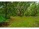 Charming home nestled among lush greenery with a screened porch at 8389 Chisolm Plantation Rd, Edisto Island, SC 29438