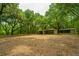 Horse barn with three stalls and a tack room situated on a sprawling wooded lot at 8389 Chisolm Plantation Rd, Edisto Island, SC 29438