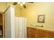 Bathroom with shower, wood paneling, and towel rack at 8389 Chisolm Plantation Rd, Edisto Island, SC 29438