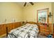 Bedroom with wood-framed bed, wooden dresser, and ceiling fan at 8389 Chisolm Plantation Rd, Edisto Island, SC 29438