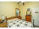 Bedroom featuring a wood-framed bed, dresser, ceiling fan, and charming decor at 8389 Chisolm Plantation Rd, Edisto Island, SC 29438