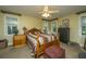 Bedroom with a wooden bed, nightstands, and a dresser at 8389 Chisolm Plantation Rd, Edisto Island, SC 29438
