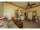 Bonus room with tile flooring, ceiling fan, and built-in shelving at 8389 Chisolm Plantation Rd, Edisto Island, SC 29438