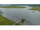Private dock with boat lift on a waterway at 8389 Chisolm Plantation Rd, Edisto Island, SC 29438